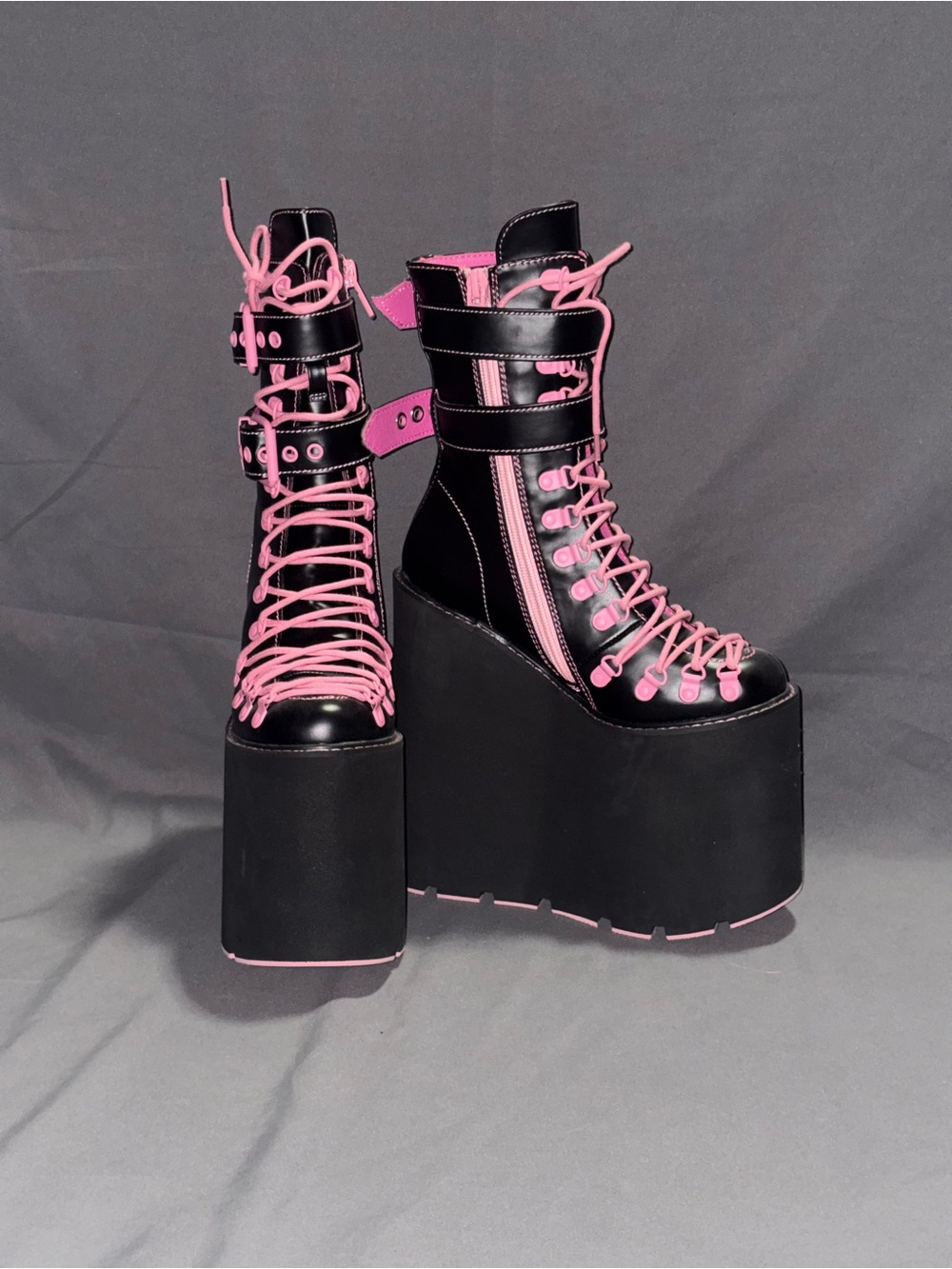 Extra tall pink and black platform traitor boots